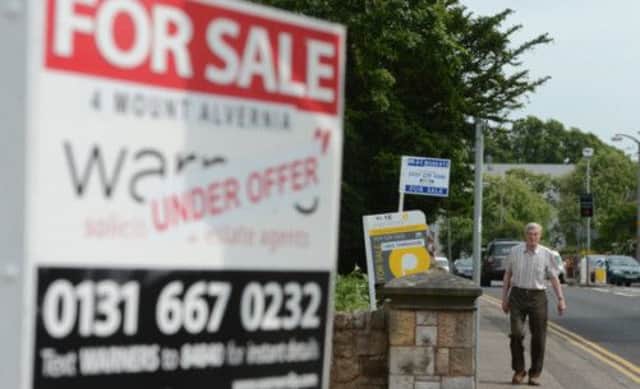 The property market is showing signs of improvement with buyers scanning estate agents for their dream home. Picture: Neil Hanna