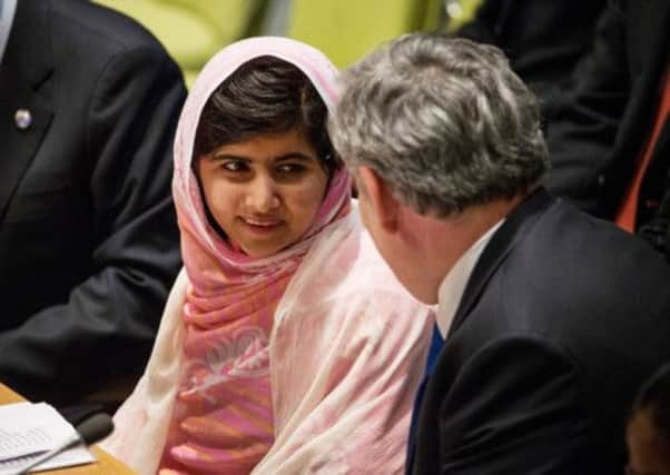 Malala Yousafzai speaks to former Prime Minister Gordon Brown at the UN Youth Assembly in New York. Picture: Getty