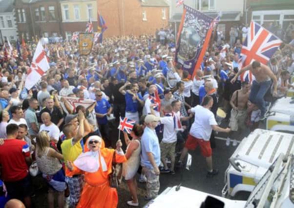 Loyalists confront police in north Belfast yesterday. 400 extra officers from England, Scotland and Wales have been sent to the province. Picture: PA