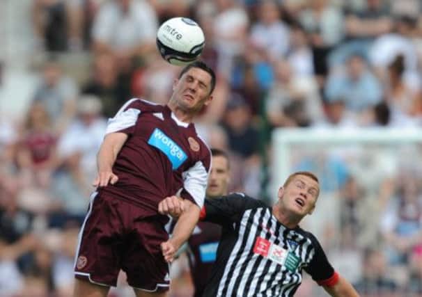 Dylan McGowan contests the ball with Dunfermline's Ryan Thomson. Picture: Getty