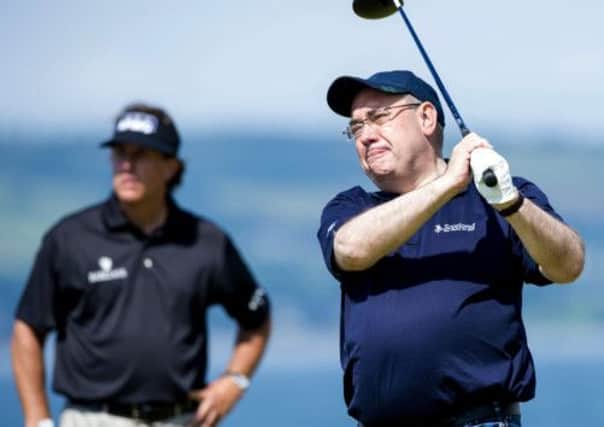 First Minister Alex Salmond watches his tee shot at the Scottish Open Pro-am. Picture: SNS