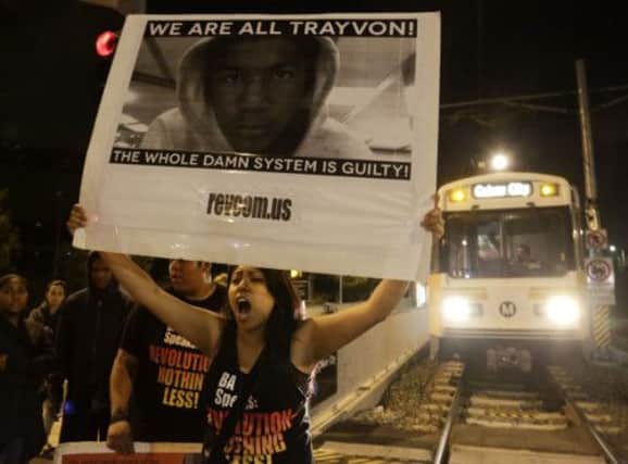 A protester blocks a train line following George Zimmermans acquittal, a verdict that sparked widespread outrage. Picture: Reuters