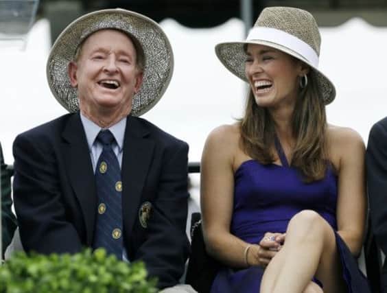 Tennis great Martina Hingis laughs with Hall of Famer Rod Laver. Picture: AP