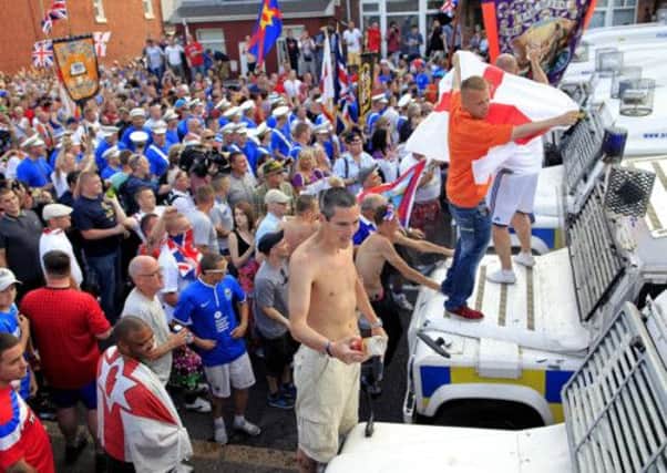 Loyalists confront police in north Belfast. Picture: PA