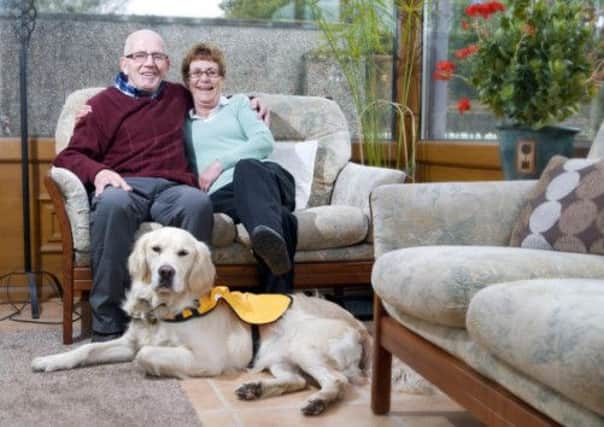 Maureen and Frank Benham say they have been given their lives back thanks to their pet dog, two-year-old golden labrador Kaspa. Picture: PA