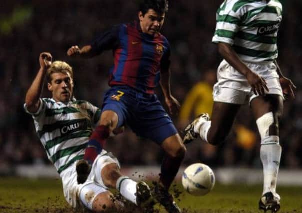 Saviola takes on Stiliyan Petrov as Barcelona play Celtic in 2004. Picture: Robert Perry