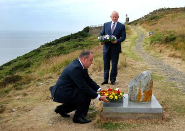 Alex Salmond and Allan Bell lay wreaths at the Solway Harvester Memorial. Picture: Michael Craine