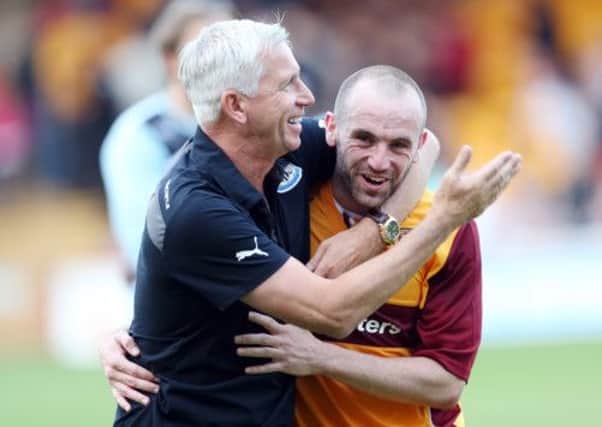 Newcastle manager Alan Pardew hugs James McFadden after the match. Picture: Getty