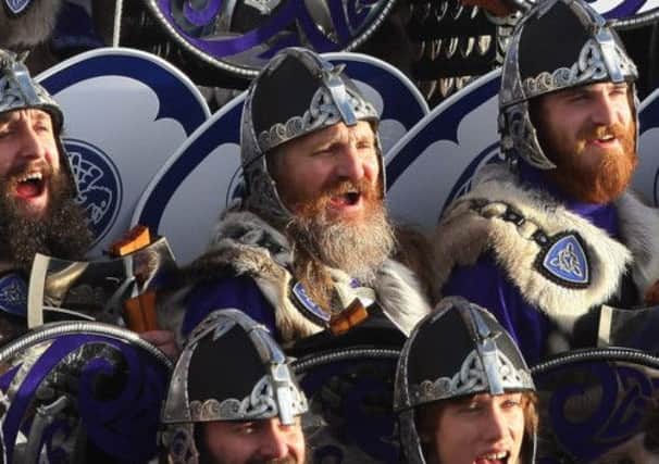 The Jarl Squad parade the streets of Lerwick during Shetlands Up Helly Aa festival. Picture: PA