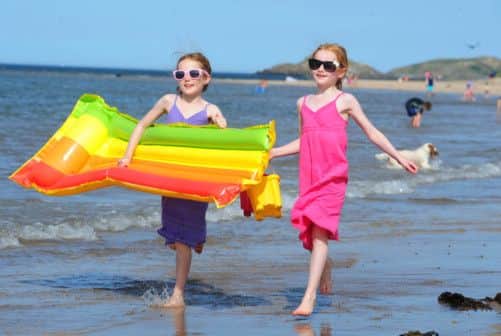 Sisters Lily and Cara Huinter at Yellowcraigs beach, East Lothian. Picture: Ian Rutherford