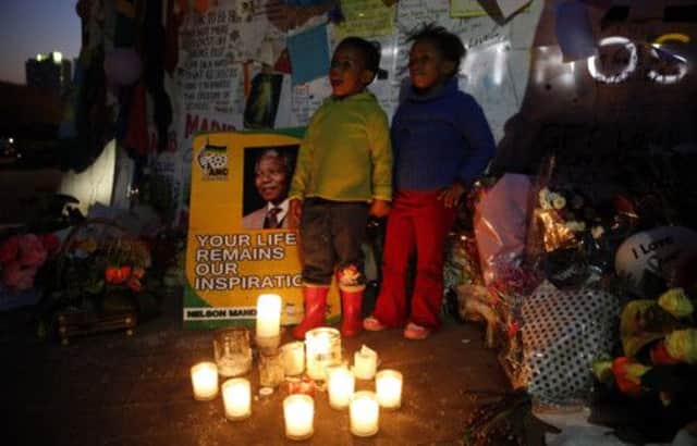 Children sing "Happy Birthday" in front of messages of support outside the hospital. Picture: Reuters