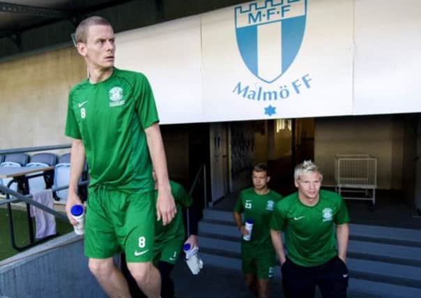 Scott Robertson, left, comes up the tunnel for training at the Swedbank Stadion in Malmo. Picture: SNS