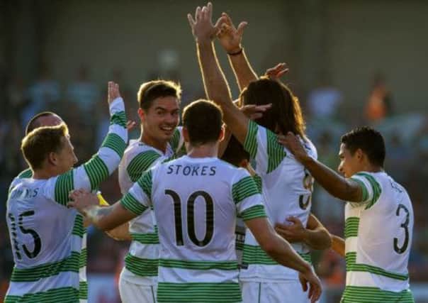 Georgios Samaras, centre, is mobbed by team-mates. Picture: SNS