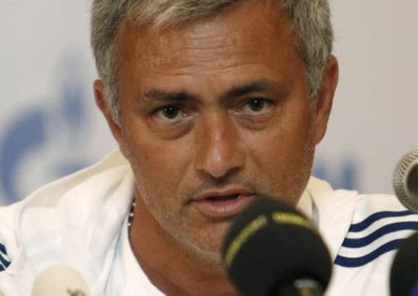 A happy Jose Mourinho underlines his feelings for Chelsea during a press conference in Kuala Lumpur, Malaysia. Picture: AP