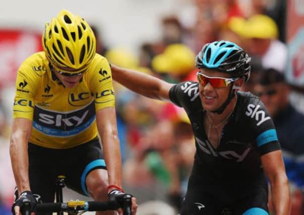 Sky team-mates Chris Froome, left, and Richie Porte cross the finishing line together. Picture: Getty