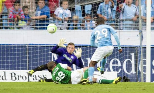 Hibernian goalkeeper Ben Williams saves from Malmo striker Tokelo Rantie during the first leg of their Europa League qualifier. Picture: SNS