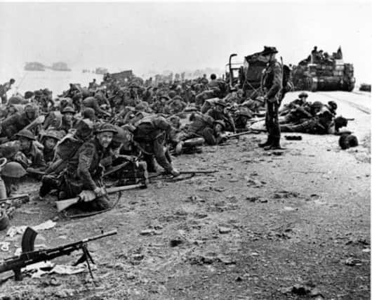 British troops await the signal to move forward, during the Allied landings in Normandy on June 6, 1944. Picture: AP
