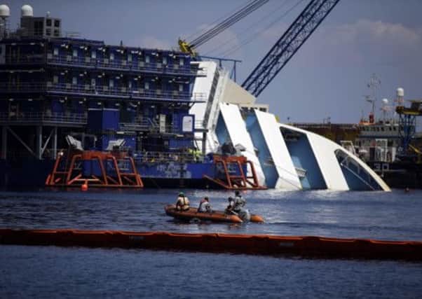 The Costa Concordia cruise ship lies on its side in the Tuscan Island of Isola del Giglio. Picture: AP