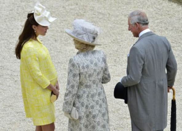 The Duchess of Cambridge chats to the Duchess of Cornwall and Prince Charles, with 'sprog' due imminently. Picture: Getty
