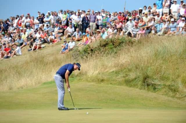 Phil Mickelson, in action on the third green, is still in contention at Muirfield after a frustrating start.  Picture: Jane Barlow
