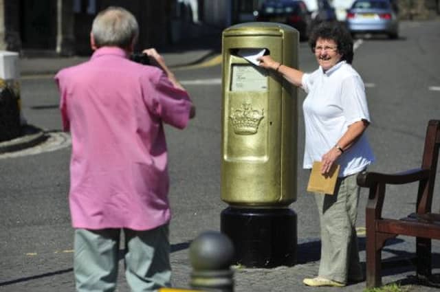 A 'must see' destination on the Andy Murray trail is the gold post box situated at the roundabout on the High Street. Picture: Robert Perry