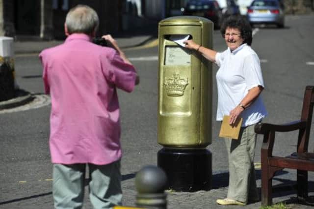 A 'must see' destination on the Andy Murray trail is the gold post box situated at the roundabout on the High Street. Picture: Robert Perry