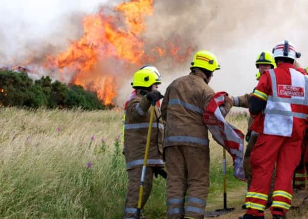 Firefighters attending a blaze on Arthur's Seat in Edinburgh. Picture: Joey Kelly (joeykelly.co.uk)