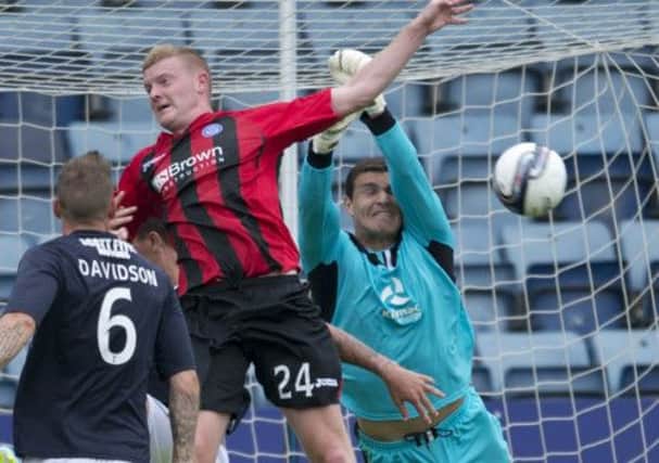 Kilmarnock keeper Kyle Letheren clears the ball away from Dundees Brian Easton  Picture: Rob Casey/SNS