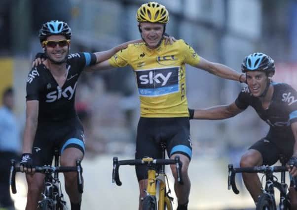 A triumphant Chris Froome his flanked by his Team Sky team-mates after they helped him dominate the 100th Tour de France. Picture: AP