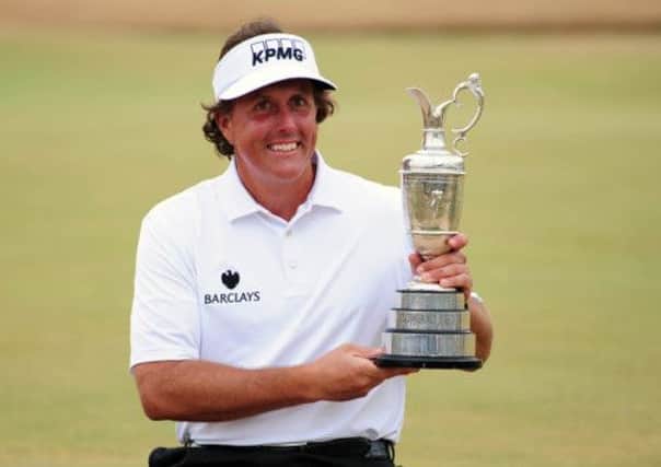 Phil Mickelson was beaming as he lifted the Claret Jug at Muirfield. Picture: Ian Rutherford