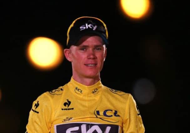 Chris Froome basks in Tour de France glory on the podium. Picture: Getty