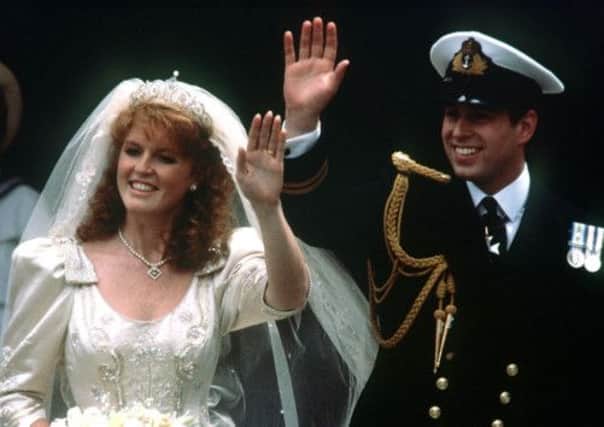 Prince Andrew and his bride Sarah Ferguson wave to well-wishers after their marriage ceremony on this day in 1986. Picture: PA