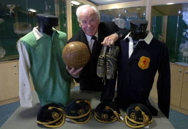 Lawrie Reilly with shirts he wore for Hibs and Scotland in the Hibs museum at Easter Rd. Picture: Kenny Smith