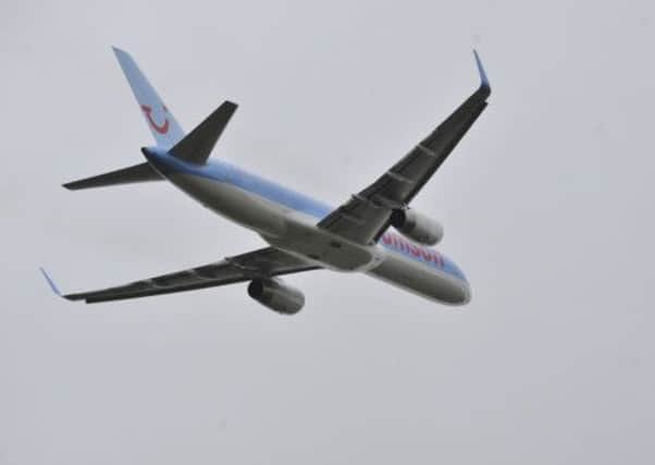 A Thomson plane above Glasgow airport - more of the aircraft will be seen over Aberdeen soon. Picture: Robert Perry