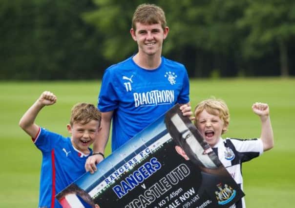 Youngsters Jake Maxwell, left, and Cooper Knox join David Templeton to promote the friendly. Picture: SNS