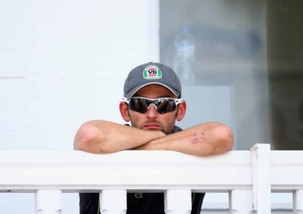 Nathan Lyon watches Test action from the balcony. Glenn McGrath wants him in the middle. Picture: Getty