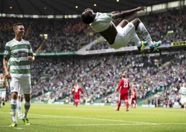 Efe Ambrose with an acrobratic celebration of his goal against Cliftonville at Celtic Park. Picture: SNS