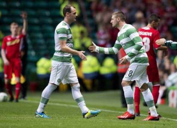 Celtic striker Anthony Stokes (left) is replaced by team-mate Gary Hooper. Picture: SNS
