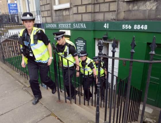 PIC PHIL WILKINSON.TSPL / JOHNSTON PRESS

LONDON STREET SAUNA , EDINBURGH. 
POLICE  LEAVE THE SAUNA TODAY AFTER SPENDING OVER AN HOUR AT THE PREMISES.
