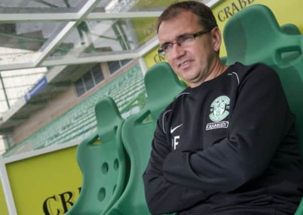 Hibernian manager Pat Fenlon has urged players to lift supporters who have undergone a 'sad and difficult' week. Picture: SNS