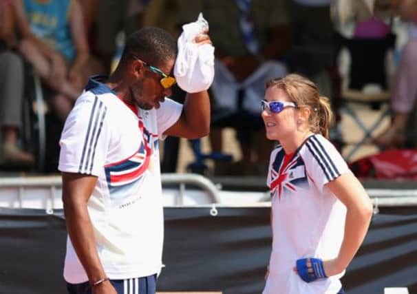 Libby Clegg and guide Mikhail Huggins cool down with some ice in Lyon.  Picture: Getty