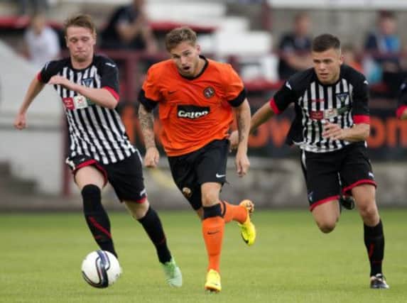 David Goodwillie races clear of the Dunfermline defence. Picture: SNS