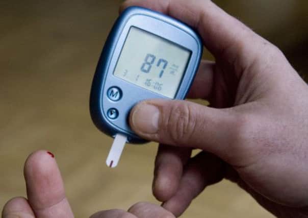 A diabetic tests his blood sugar level. Picture: AP