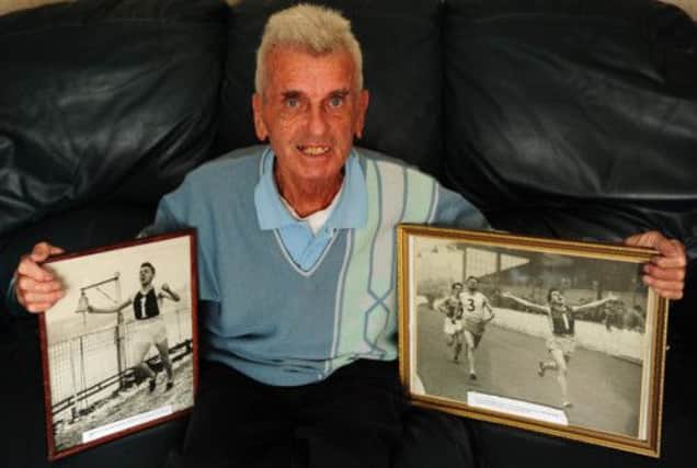 Michael Glen pictured at home in Bathgate with mementoes from his stellar professional running career.  Picture: Ian Rutherford