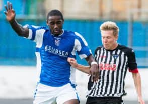 Nat Wedderburn and the Pars' Ryan Ferguson go for the ball. Picture: Ian Georgeson