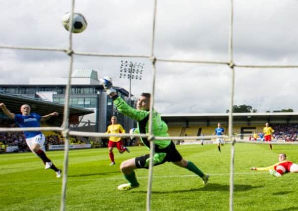 Nicky Law fires past Neil parry in the Albion Rovers goal. Picture: SNS