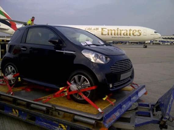 The Aston Martin Cygnet awaits boarding at Glasgow. Picture: PA