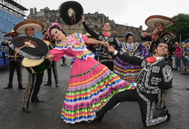 Dancer Maria-Elena Sombrererio with Mexican musicians and dancers at Edinburgh Castle. Picture: Alan Smith