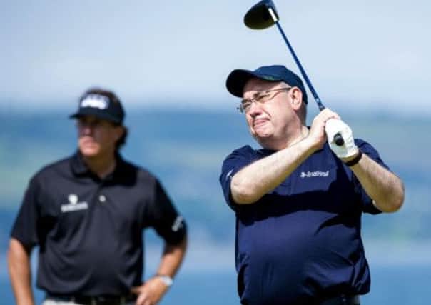 Alex Salmond tees off on a practice day before the Scottish Open at Castle Stuart. Picture: SNS