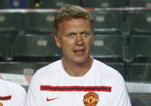 Manchester United manager David Moyes watches his team beat Kitchee 5-2 in a friendly match at Hong Kong Stadium. Picture: Reuters